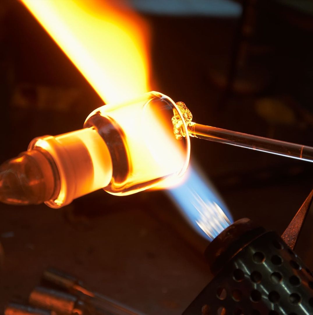 High-quality glass is shaped in a fire.
